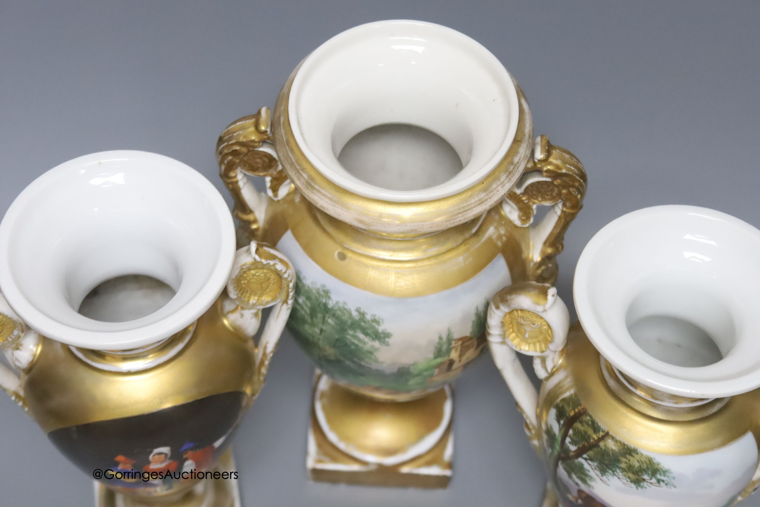 A 19th century French porcelain garniture of three vases, height 27cm